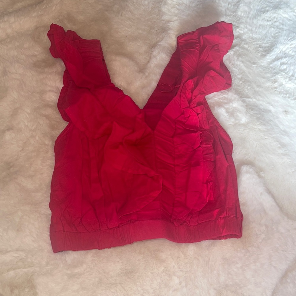 And Now This, red frilly top